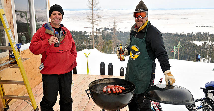 Jerry and Brian cooking over the bbq